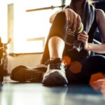 Woman resting after exercise at a gym