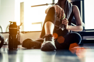 Woman resting after exercise at a gym