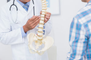 doctor explaining anatomy of spine